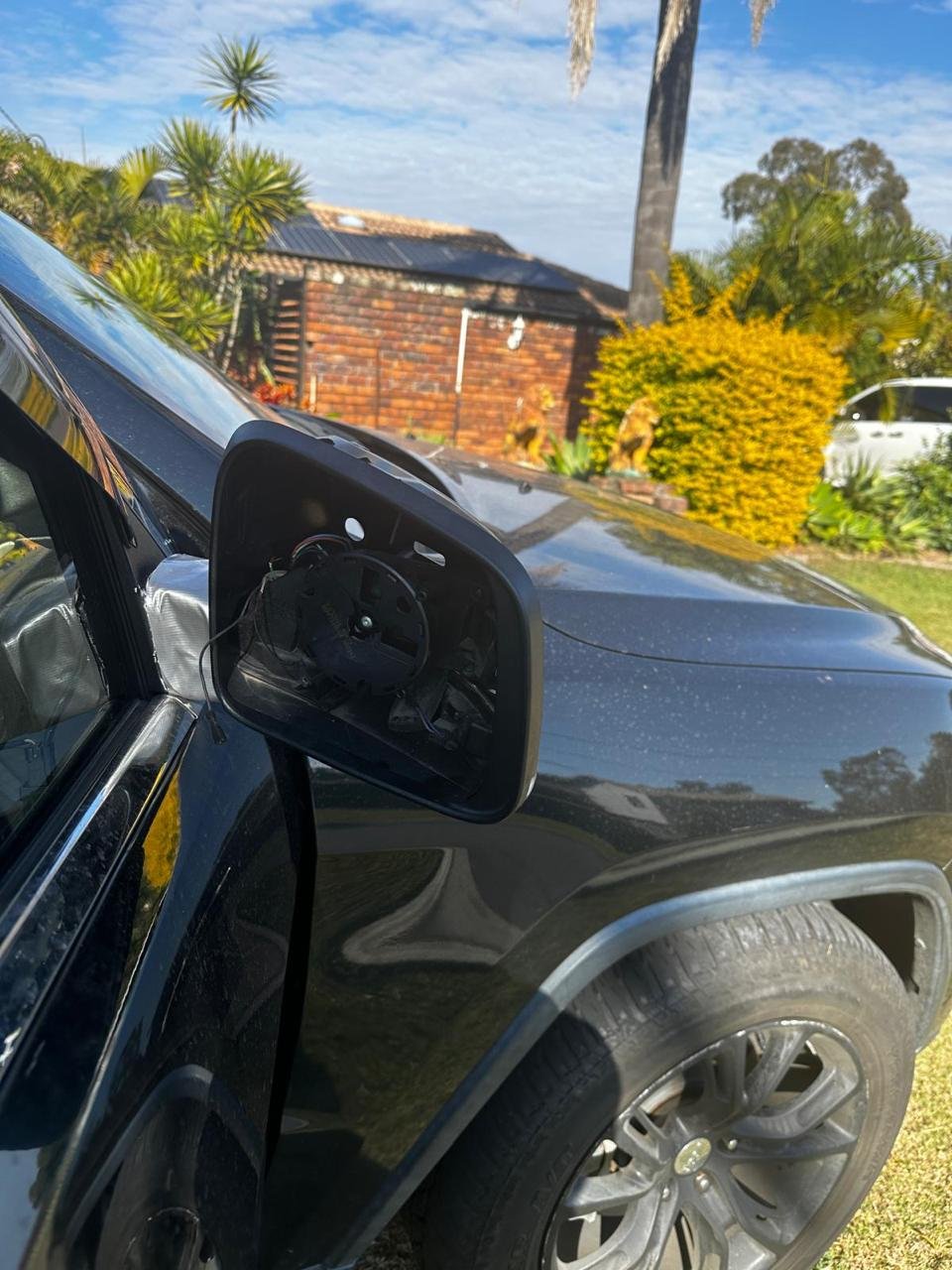 Broken side mirror before repair