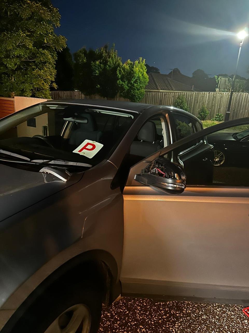 Damaged car mirror before replacement